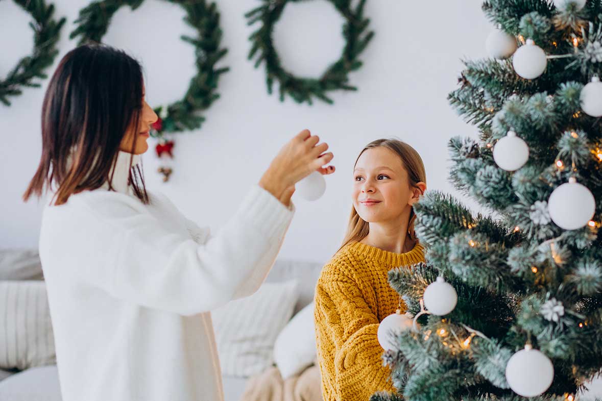 Mother Daughter Decorating Christmas Tree