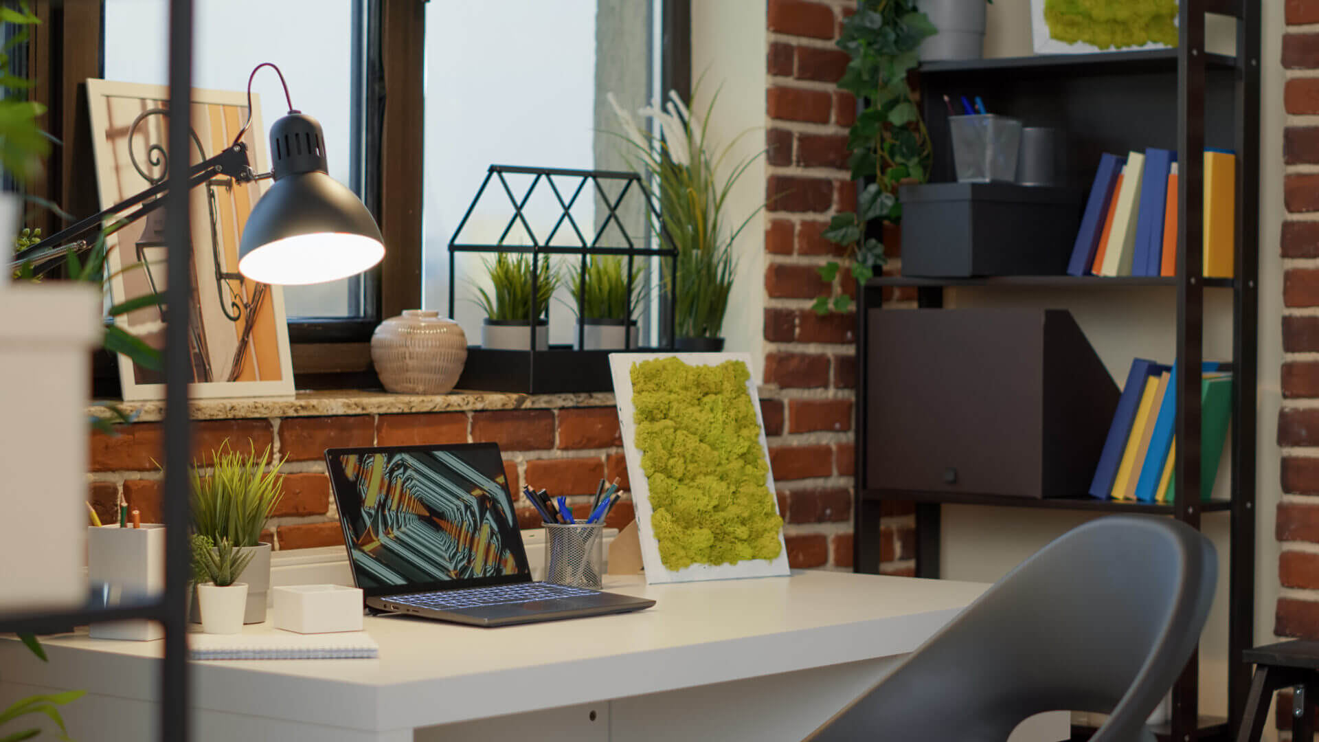 No People At Empty Desk With Laptop Computer In Apartment